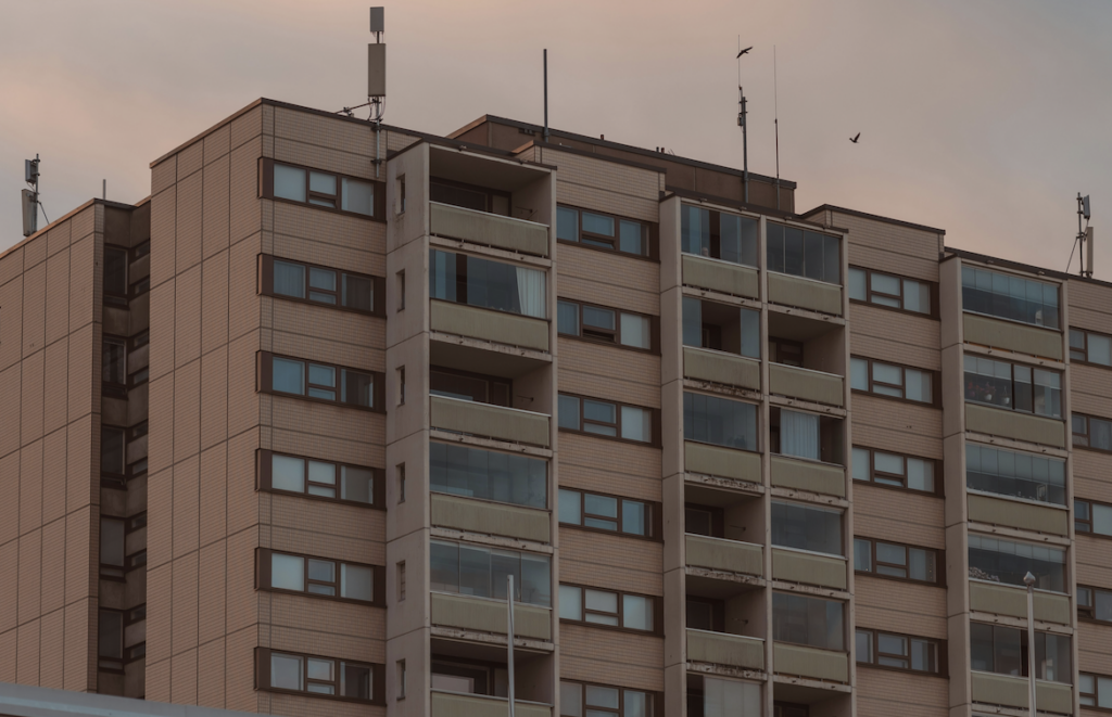 Dated, Brown Apartment Building Exterior