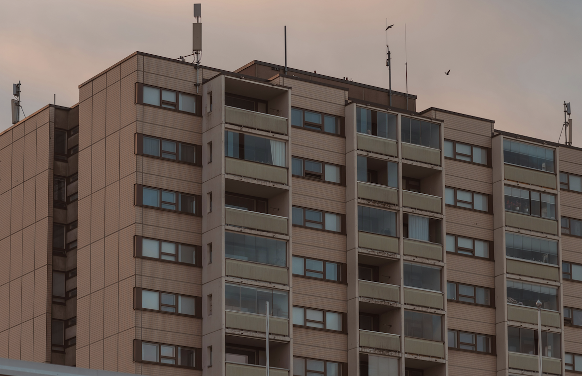 Dated, Brown Apartment Building Exterior